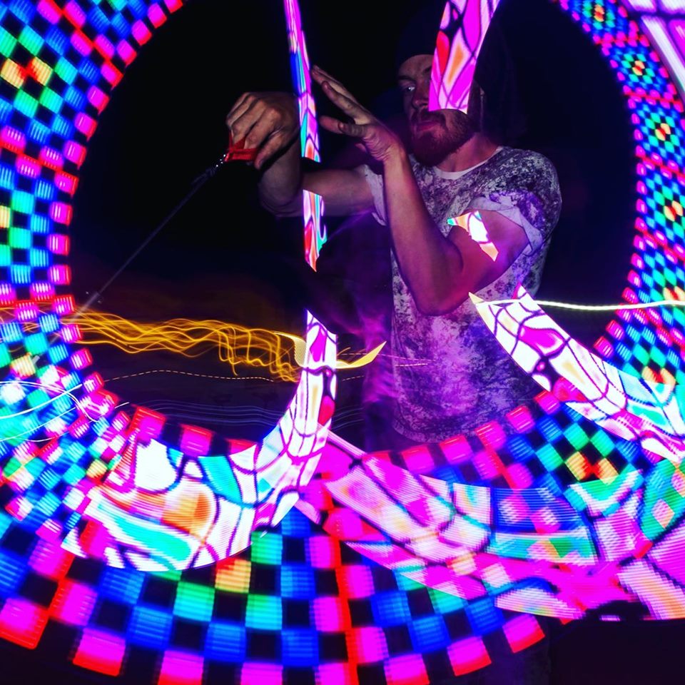 Yorkshire Circus performer creating colourful light patterns with pixel poi